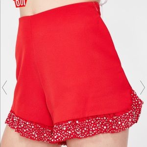 A size small pair of red shorts with rhinestones